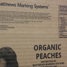 Barcode, graphics, and variable data printed on corrugated cardboard carton by a Matthews Marking System