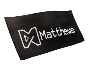 Matthews logo and name in white ink on uncured rubber