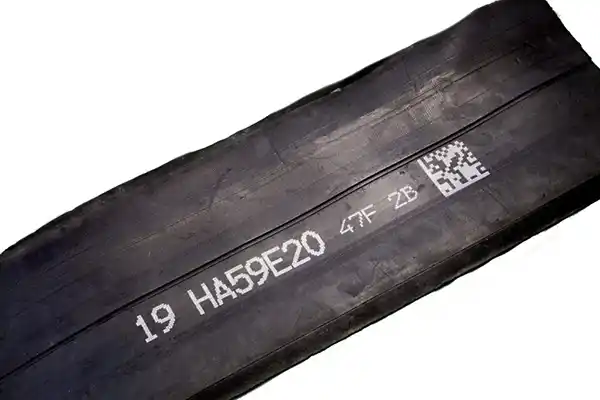 tire uncured rubber marking alphanumeric text 2D code